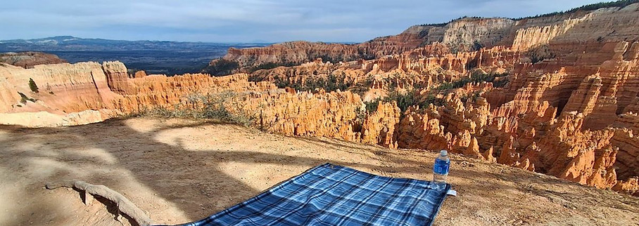 View from Rim Trail in Bryce Canyon National Park, Utah, overlooking the canyon formations and horizon.