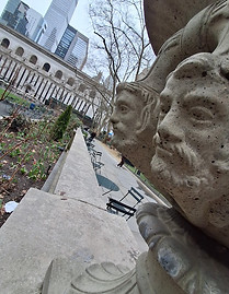 Statues and grass landscape at Bryant Park in New York City.