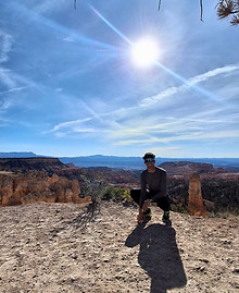 Trail runner overlooking Bryce Canyon during an early morning run near Sunrise Point, Utah.