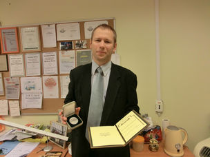 Egils Stalidzans receives a medal for Diligence