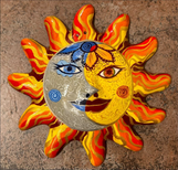 Pottery painting of the sun and the moon.