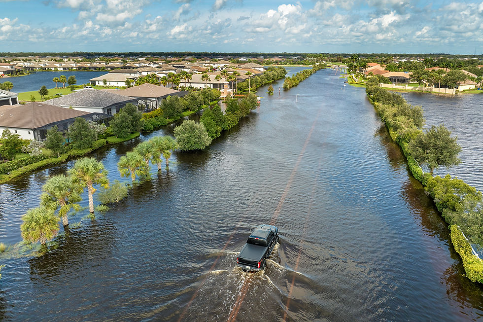 flooded-florida-street-with-stuck-car-after-hurric-2025-07-17-17-07-10-utc.jpg