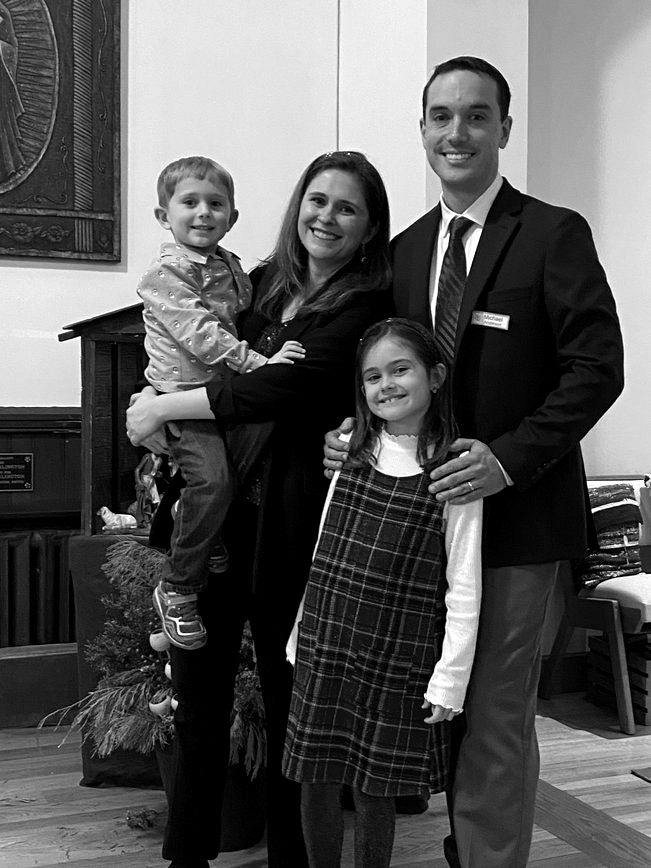 Katie Anderson standing with her family.