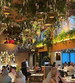 Bazaar Restaurant cardboard sphere pendant lighting with wall light and window shutters