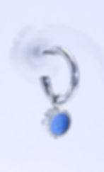 Close up of enamelled lupin blue dot interchangeable earring charm