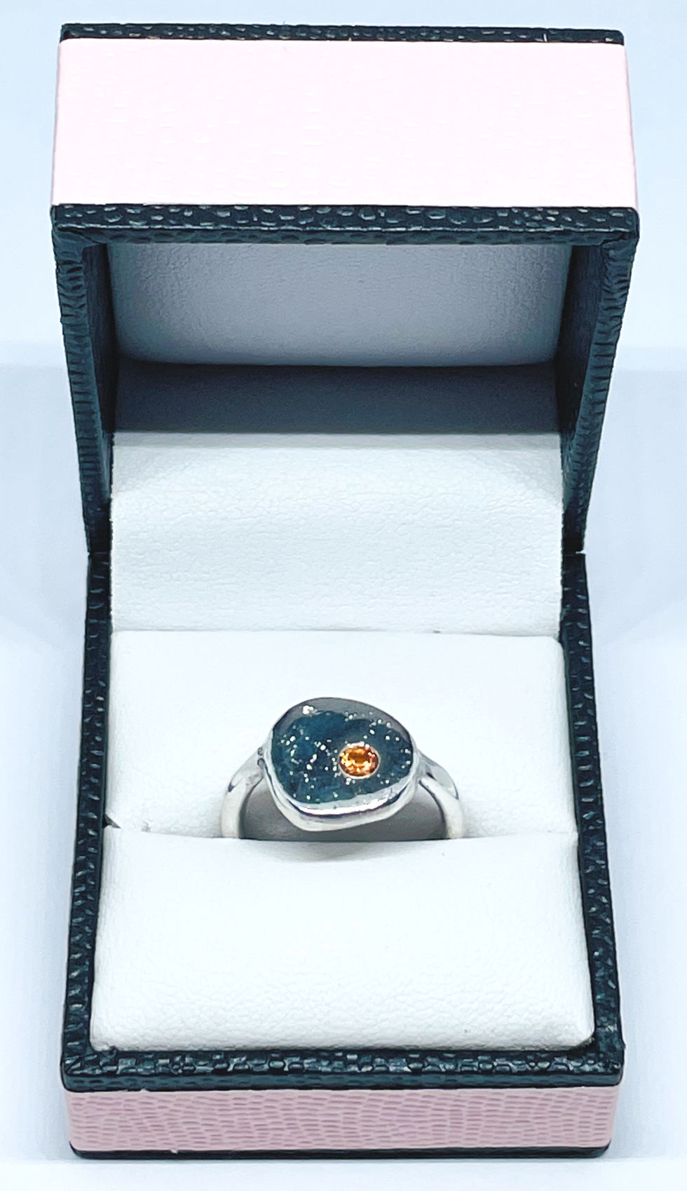 Thumbnail: Silver stone ring with an orange sapphire boxed
