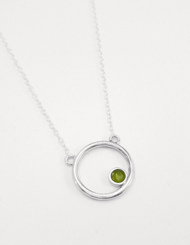 Silver Encircled pendant with transparent olive green