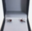 Thumbnail: Close up boxed Silver Garnet Kiss Hug studs
