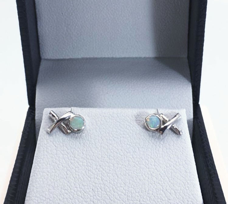 Thumbnail: Close up of boxed Silver Opal Kiss Hug studs