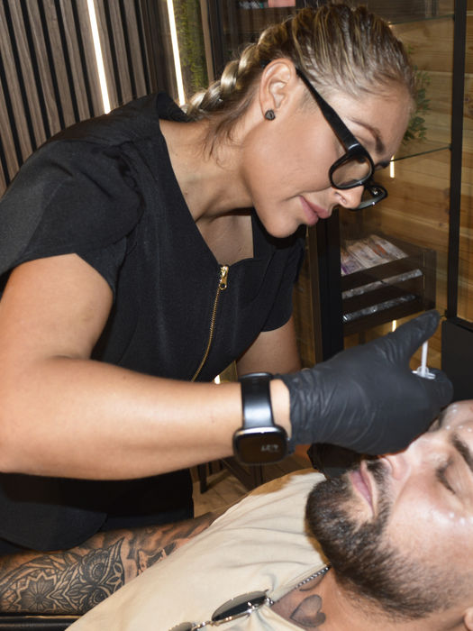 technician treating mans face