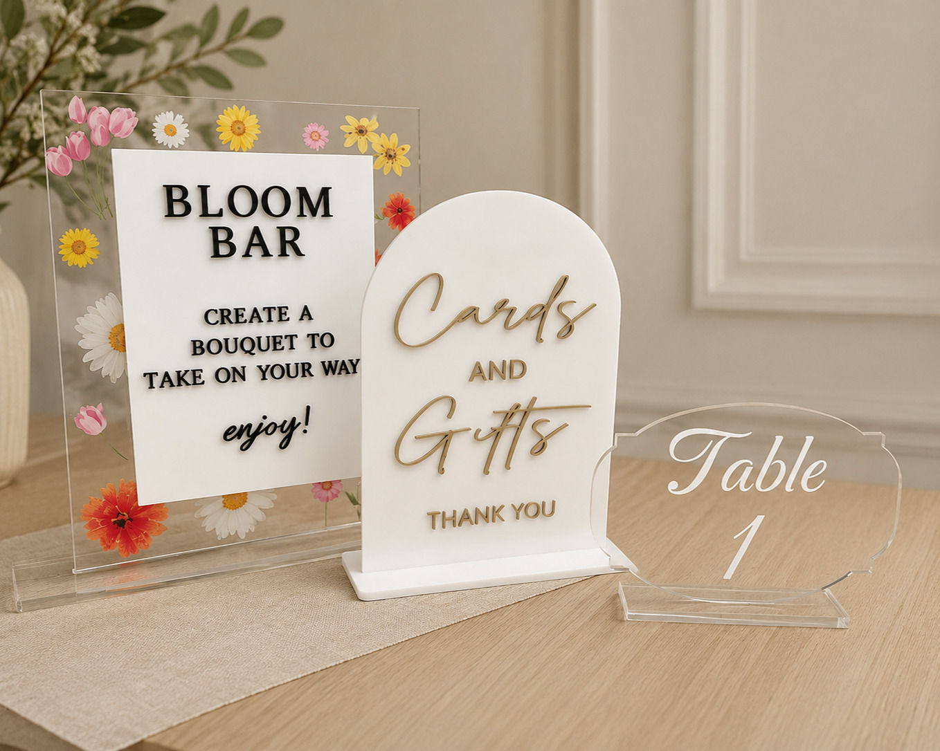 Acrylic event signage for Bloom Bar, Cards and Gifts, and Table 1.