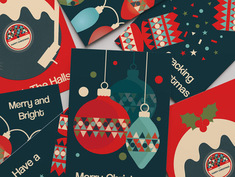 A pile of bold and colourful Christmas cards