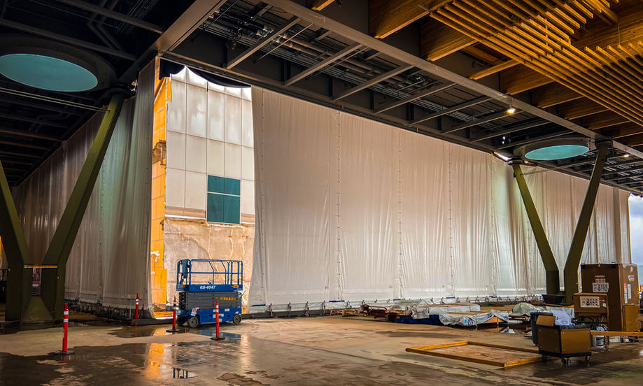 enclosed construction work zone inside active airport terminal