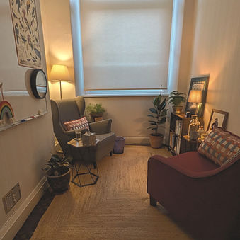 Warm, comfortable counselling room at Moss Therapies in Salts Mill, Saltaire, with cosy seating and a calm, welcoming atmosph