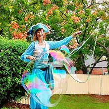 Pirate themed caracter entertainer performing giant bubbles at a kids kindergarten party