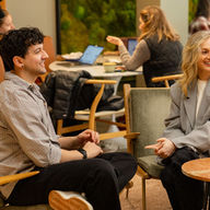 Smiling colleagues collaborating at Projects