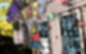 Cartoon of Lindsay walking in front of a colourful cottage_