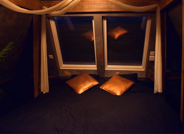 Extase luxury suite with jacuzzi, king bed, and elegant modern decor.