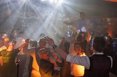 Groovy Revolution performing at a wedding with the crowd singing along to Don't Stop Me Now by Queen