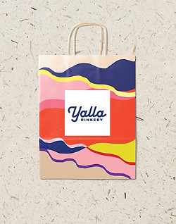 A mockup of Yalla Rinkeby's take away- bag design.