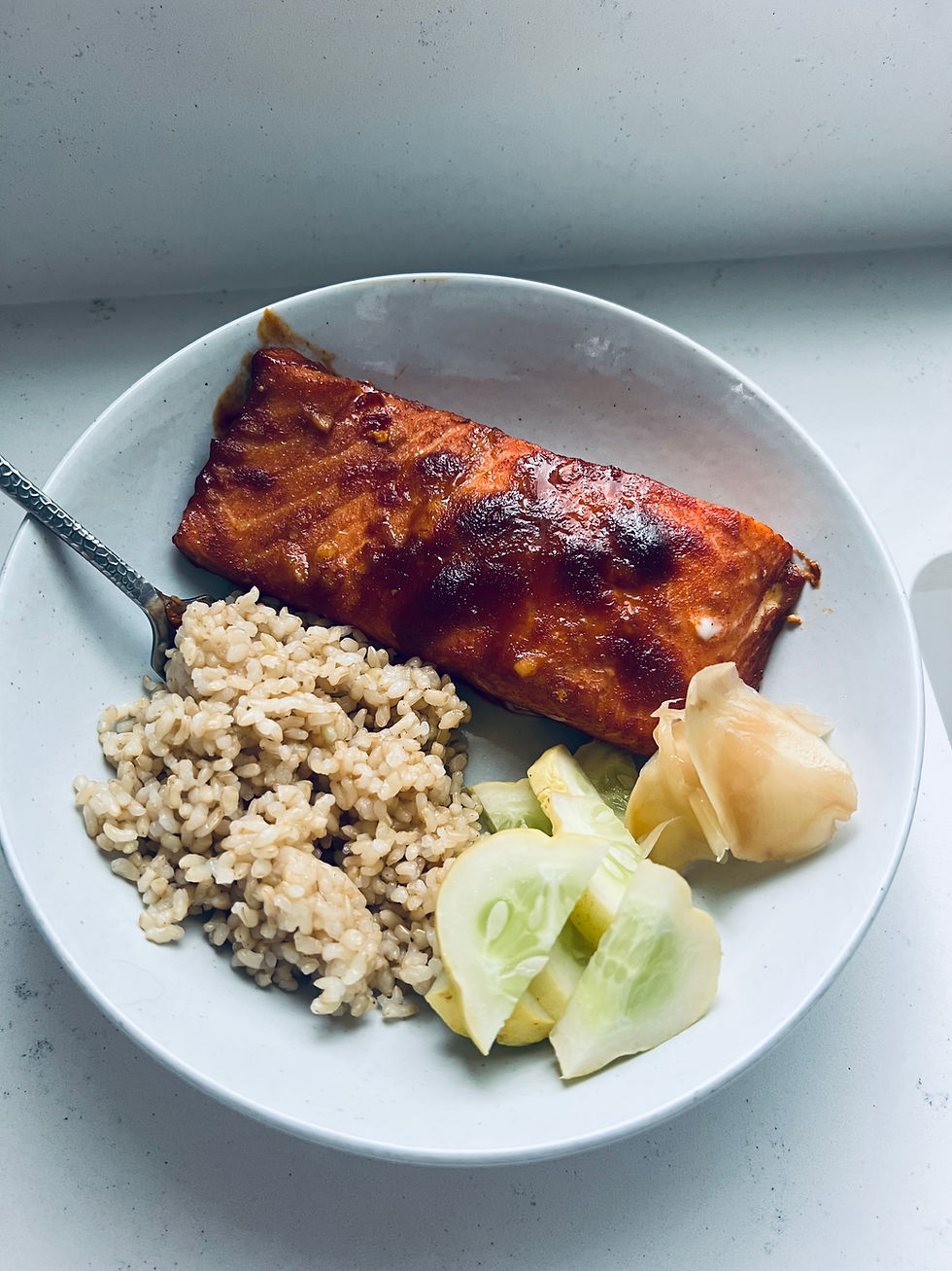 Spicy Baked Salmon with rice, cucumbers, and ginger