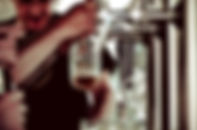 Man pouring from a beer tap