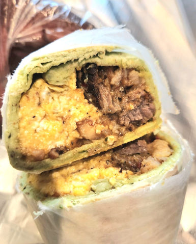 Egg, Beef, Chicken and Cheese in spinach herb wrap.
