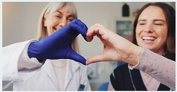Smiling Face dr and patient with love hand.jpg