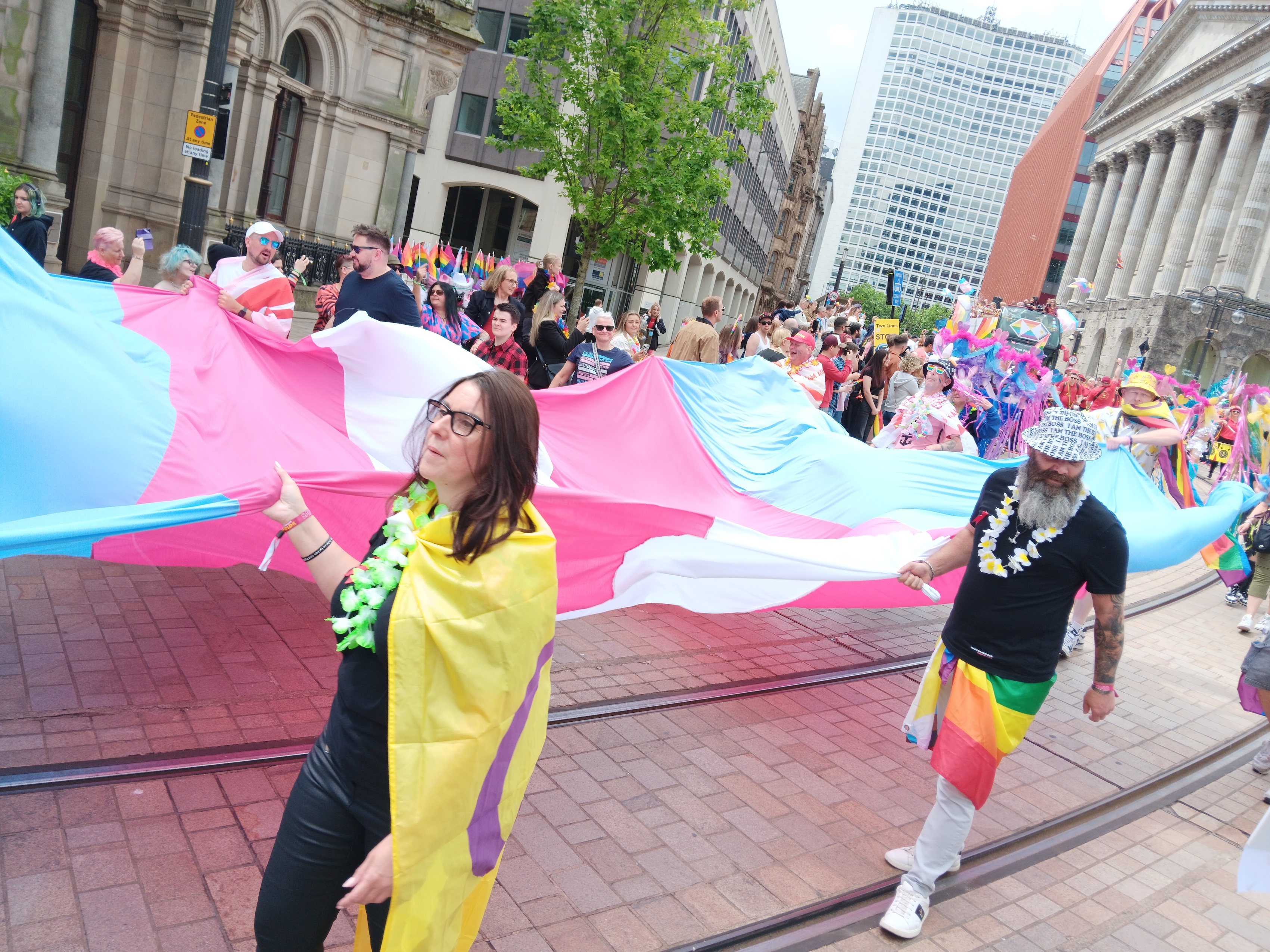 Large trans flag in parade