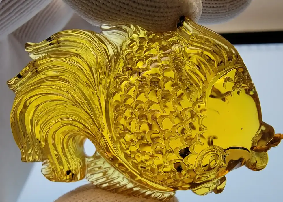 Museum-grade fish figurine set into pendant