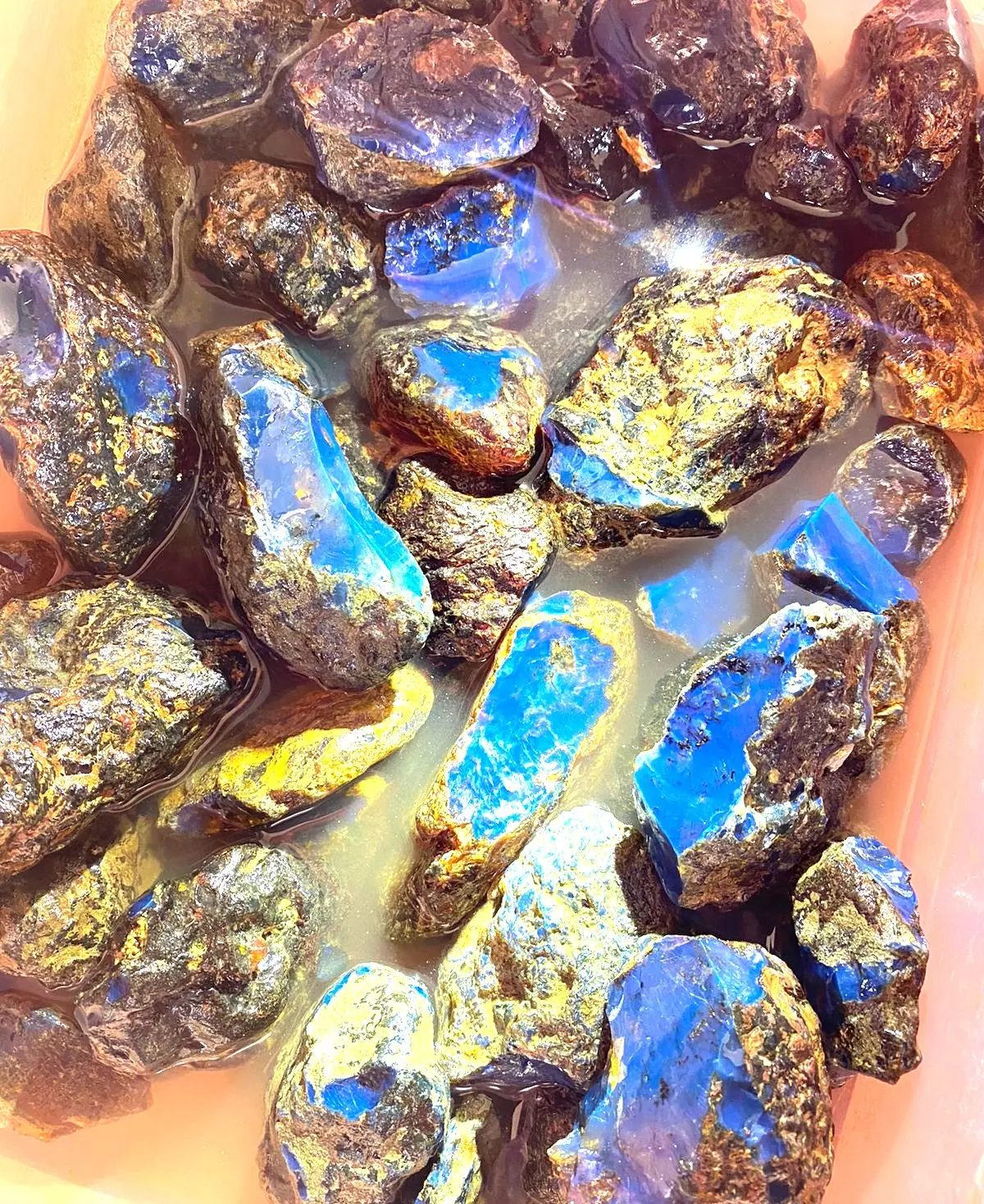 Many pieces of raw Blue Dominican Amber