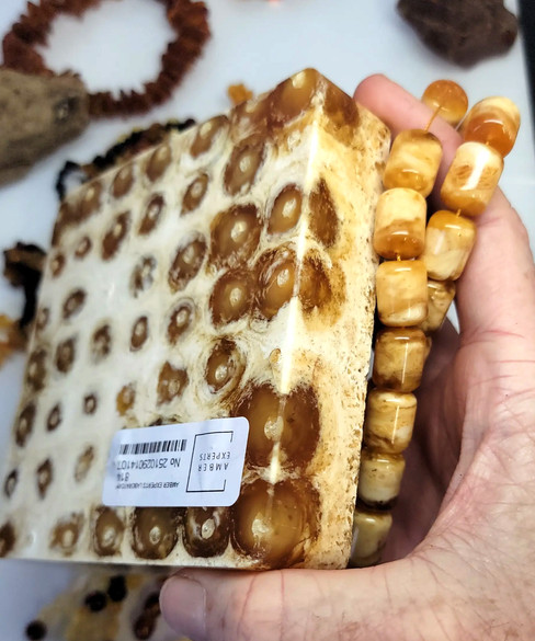 A Block of pressured Amber with same amber beads