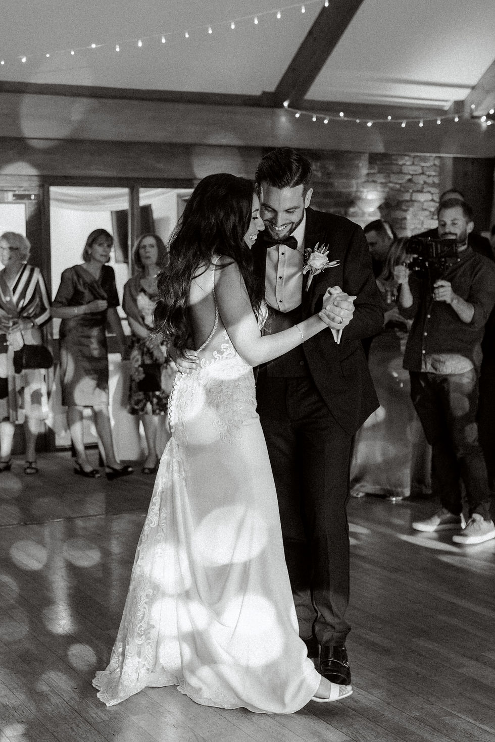 Bride and groom during their first dance by cotswolds wedding photographer desiree a north
