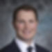 Man smiling in a suit