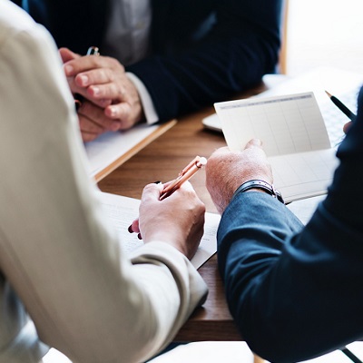 Two business people reviewing documents at a table