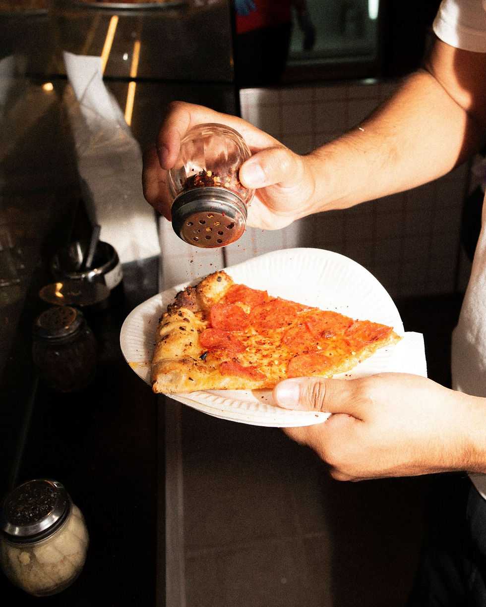 Delicious pepperoni pizza with seasoning