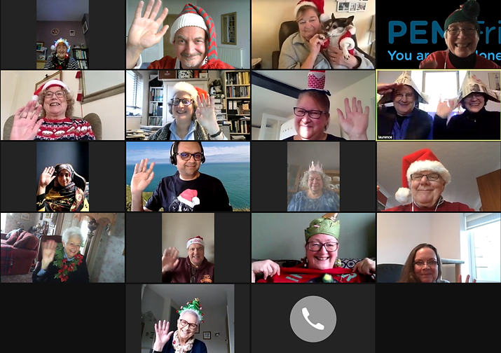 A screen shot of a Christmas Zoom meeting showing 20 people waving and dressed in festive hats