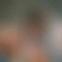 Guests socializing in a kitchen at Pines Point in Fire Island Pines.