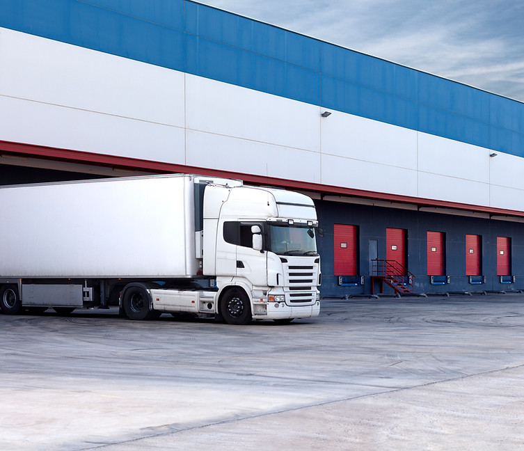 Foresee Logistics white semi truck full truck load at warehouse