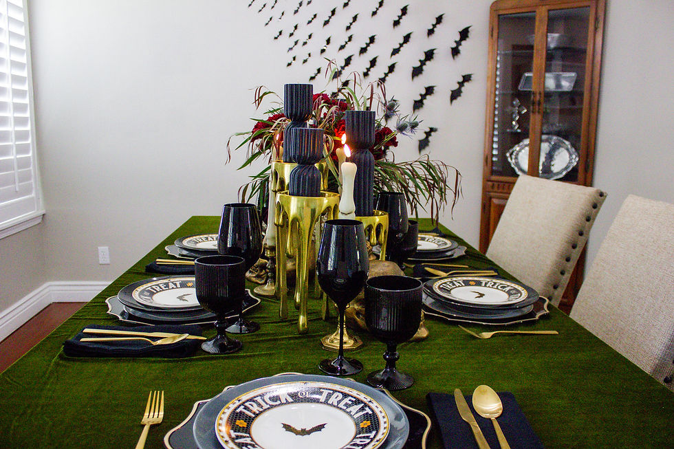 Flatware || Tablecloth || Charger Plate || Dinner Plate || Appetizer Plate || Wine Glass || Water Goblet || Bone Taper Candles || Black Pillar Candles || Gold Dripping Candle Holders || Skull Centerpiece Vase || 3-D Bat Stick Ons || Gold Skulls || Cloth Napkins