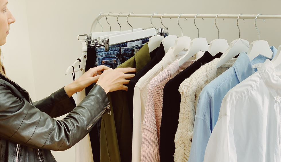 Stylist Organising Wardrobe Clothing Rail