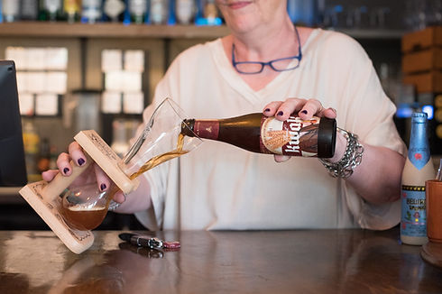 Carefully pouring a Kwak, one of our Belgian beers