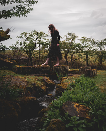Women walking by well