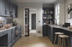 spacious galley kitchen with dark grey fitted furniture