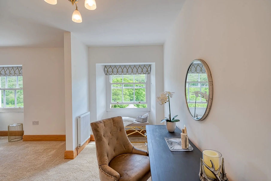Bright home staging interior with stylish oval mirror on wall