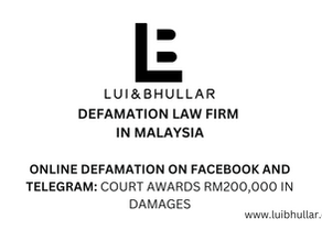 Defamation lawyer in KL reviewing evidence of Facebook and Telegram defamation case.