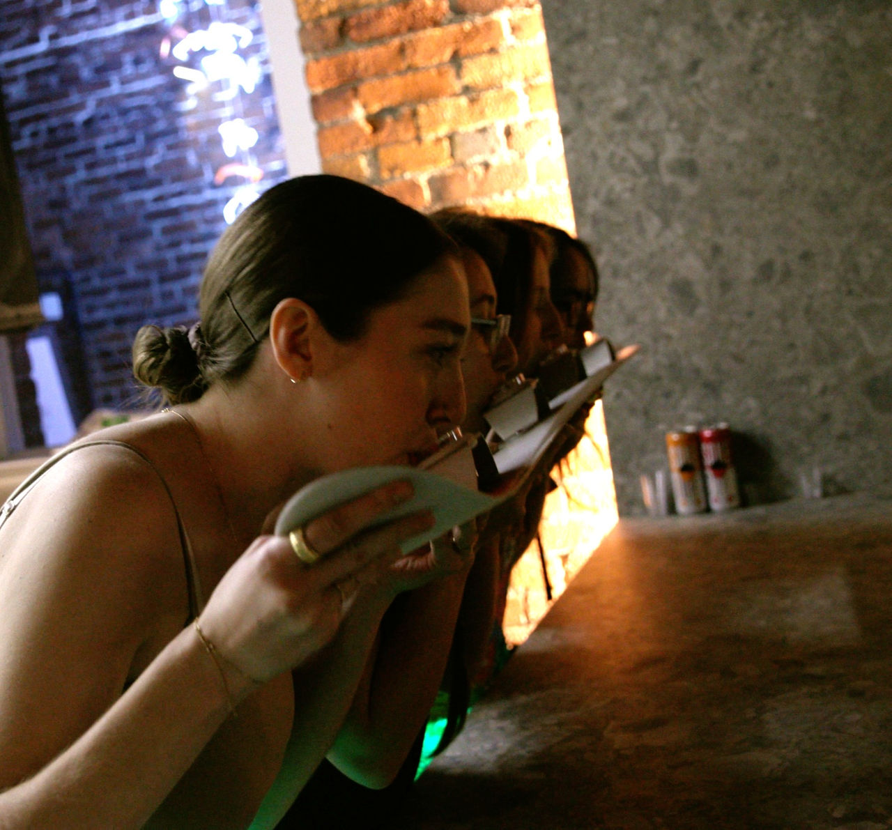 guests drinking sake bomb shots from a ski