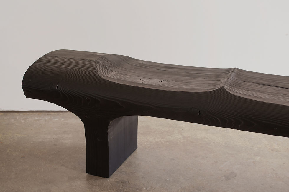 dark wood bench on concrete floor
