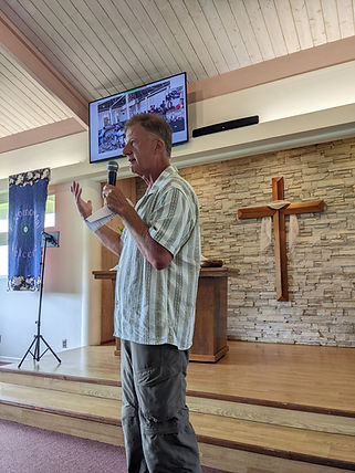 Chuck Tomek speaking in Sanuctuary.jpg