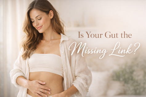 woman smiling holding her stomach with text beside " Is your gut the missing link?"